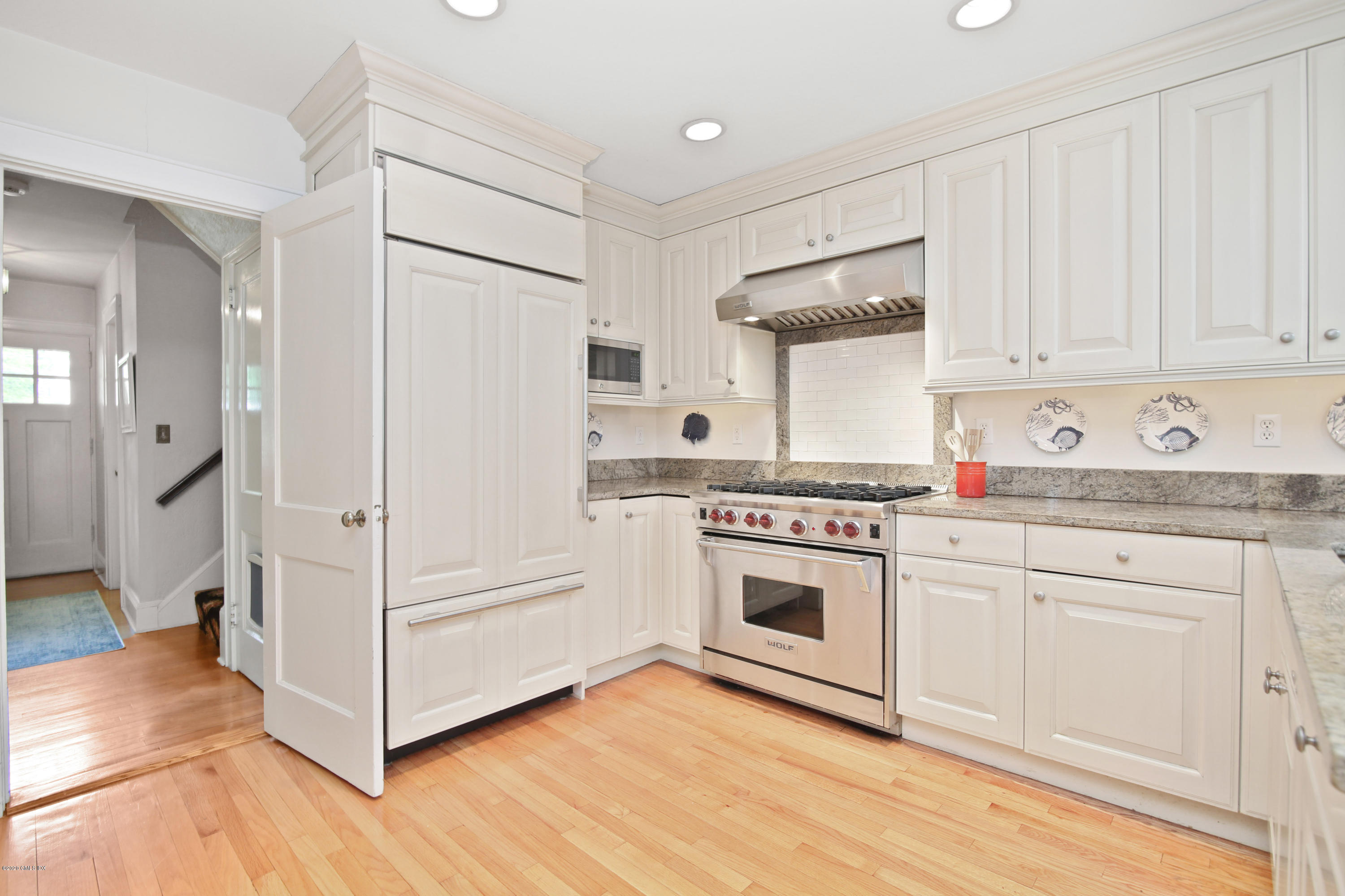 38 Oval Avenue Riverside, CT 06878 - Photo 9 of 33 a kitchen with white cabinets and white appliances