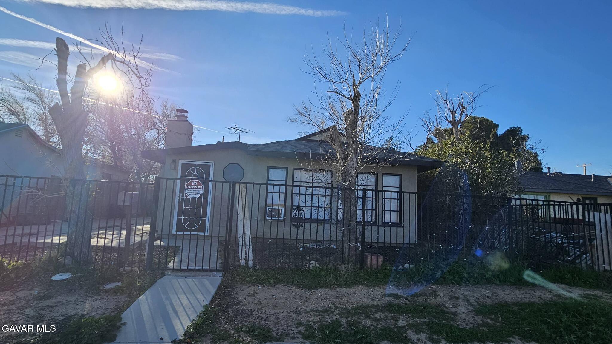15623 M Street Mojave, CA 93501 - Photo 2 of 9 a view of a house with a yard