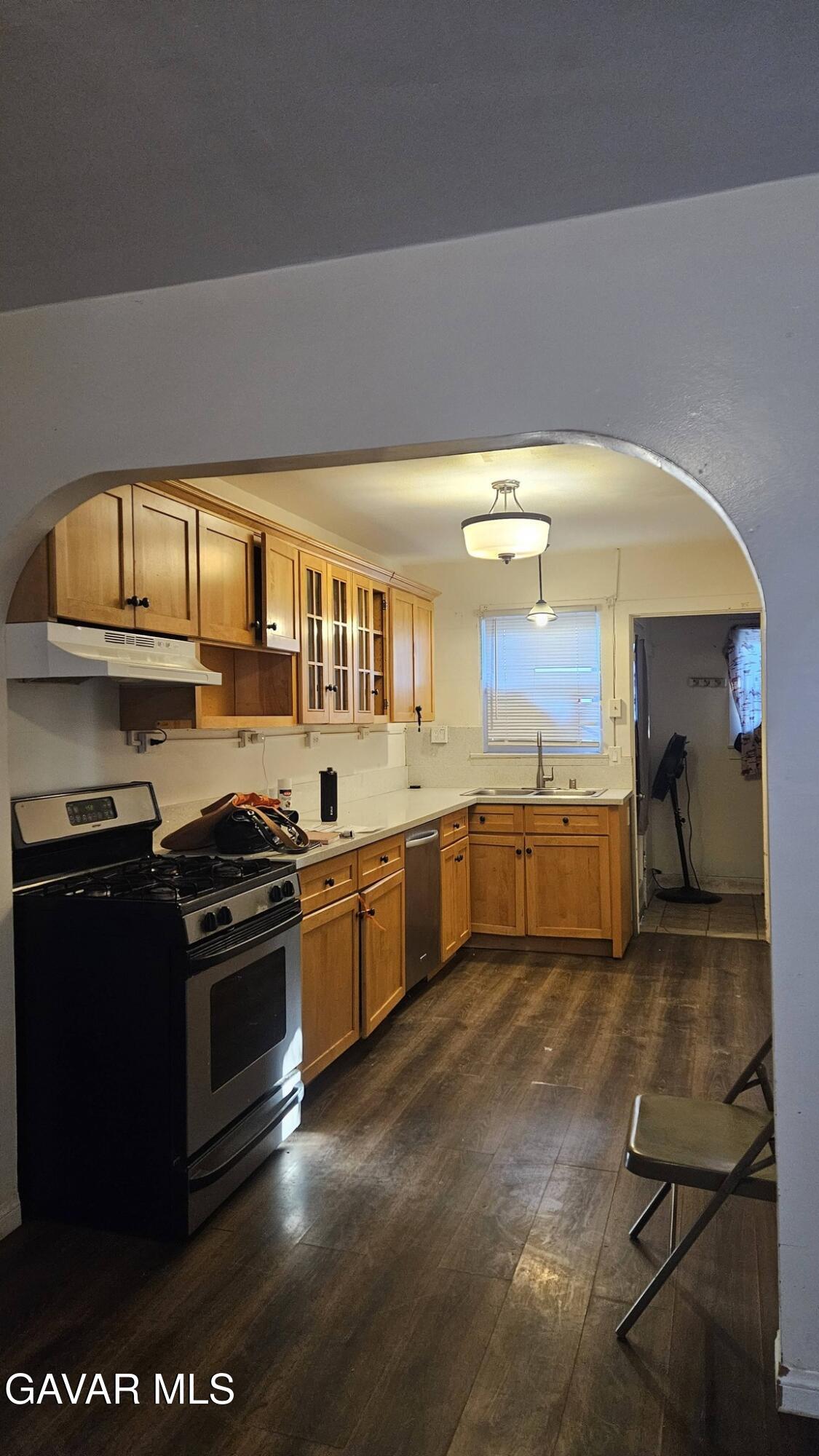 15623 M Street Mojave, CA 93501 - Photo 7 of 9 a kitchen with stainless steel appliances granite countertop a stove a sink and a microwave