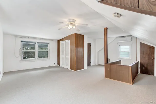 a view of an empty room with windows