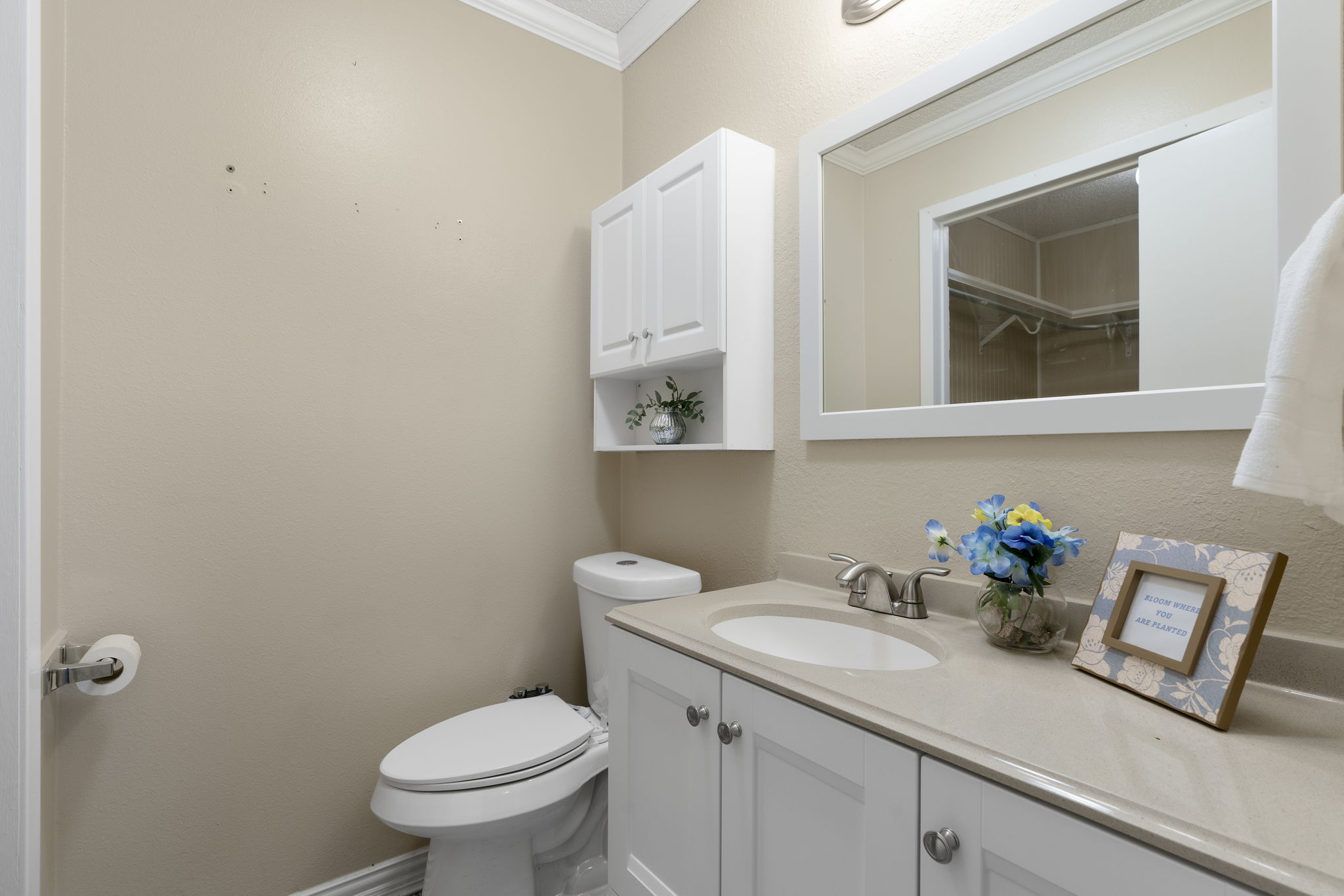 500 Grand Prairie Circle Dripping Springs, TX 78620 - Photo 20 of 40 a bathroom with a sink a toilet and mirror
