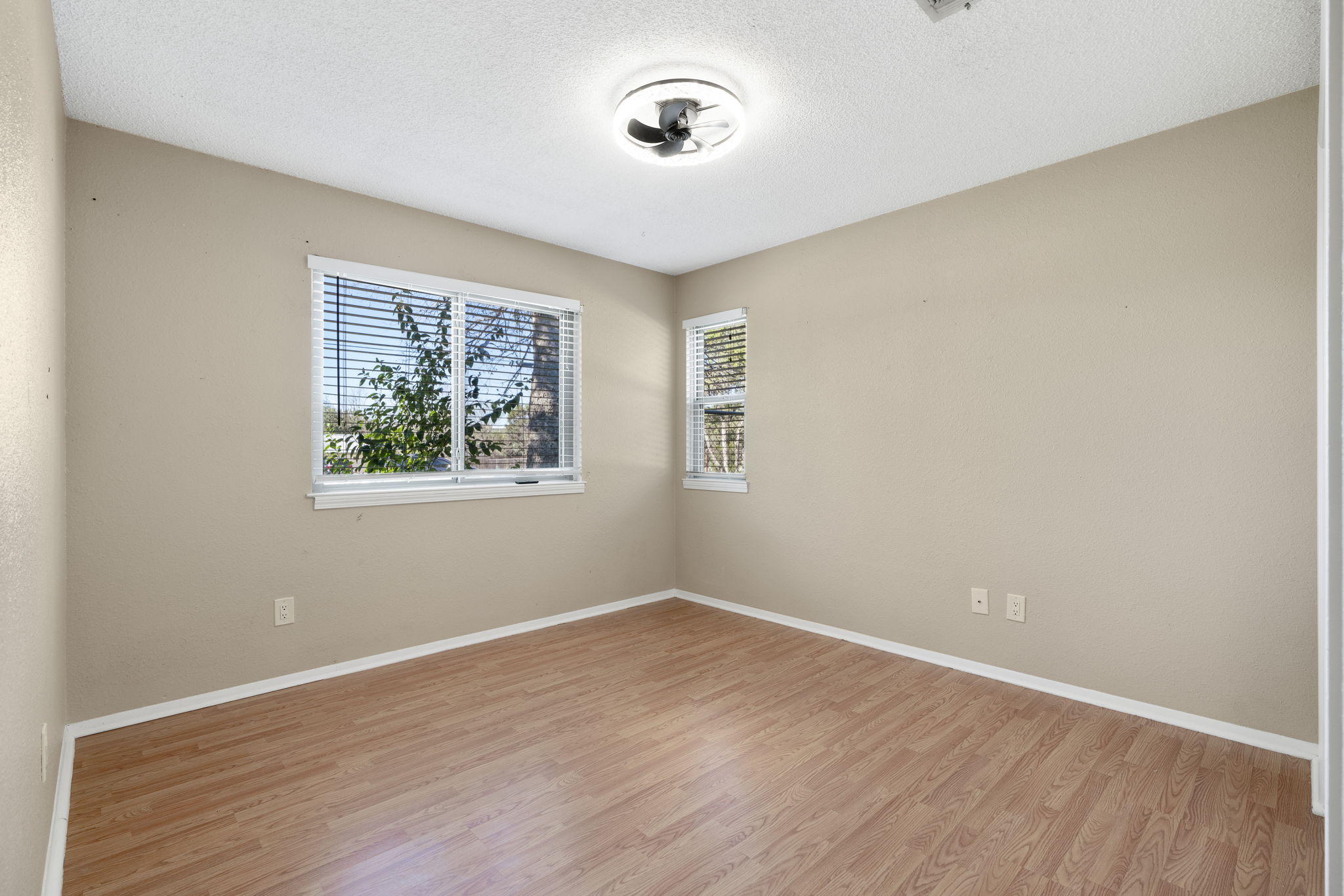 500 Grand Prairie Circle Dripping Springs, TX 78620 - Photo 22 of 40 an empty room with a window and wooden floor