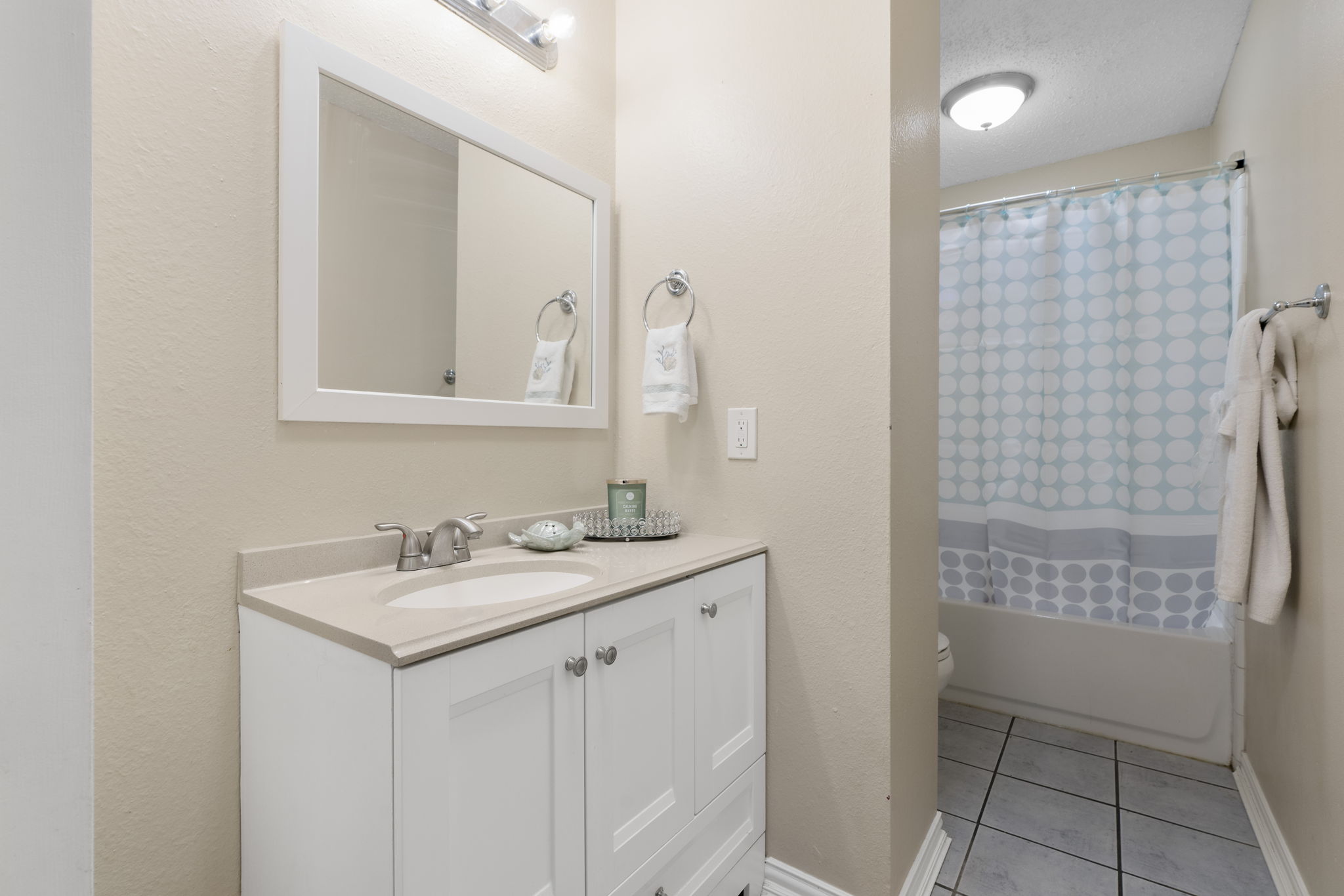 500 Grand Prairie Circle Dripping Springs, TX 78620 - Photo 23 of 40 a bathroom with a sink a toilet and shower
