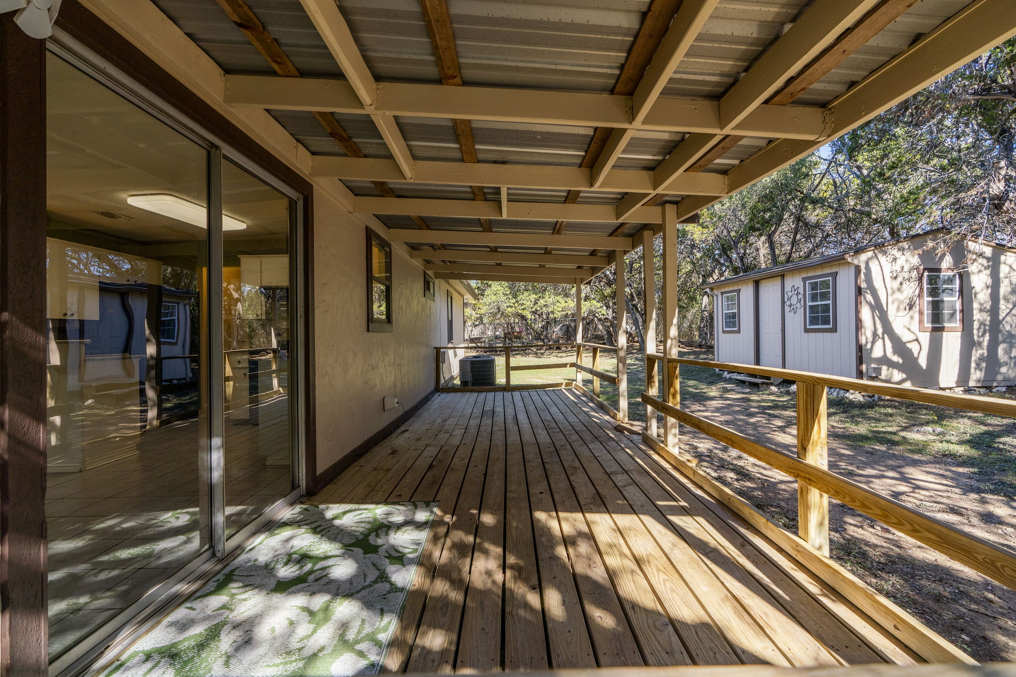 500 Grand Prairie Circle Dripping Springs, TX 78620 - Photo 26 of 40 a view of a porch with wooden floor