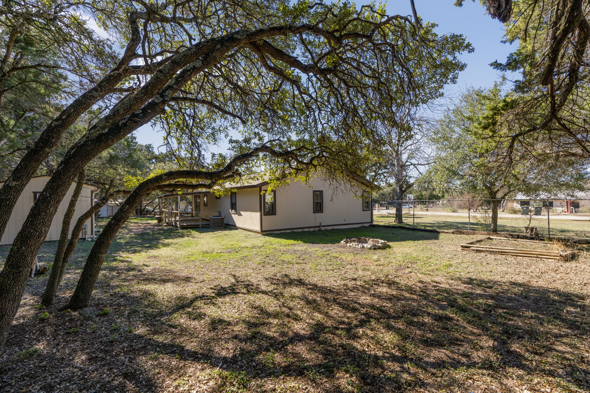 500 Grand Prairie Circle Dripping Springs, TX 78620 - Photo 31 of 40 a house is covered with snow and trees