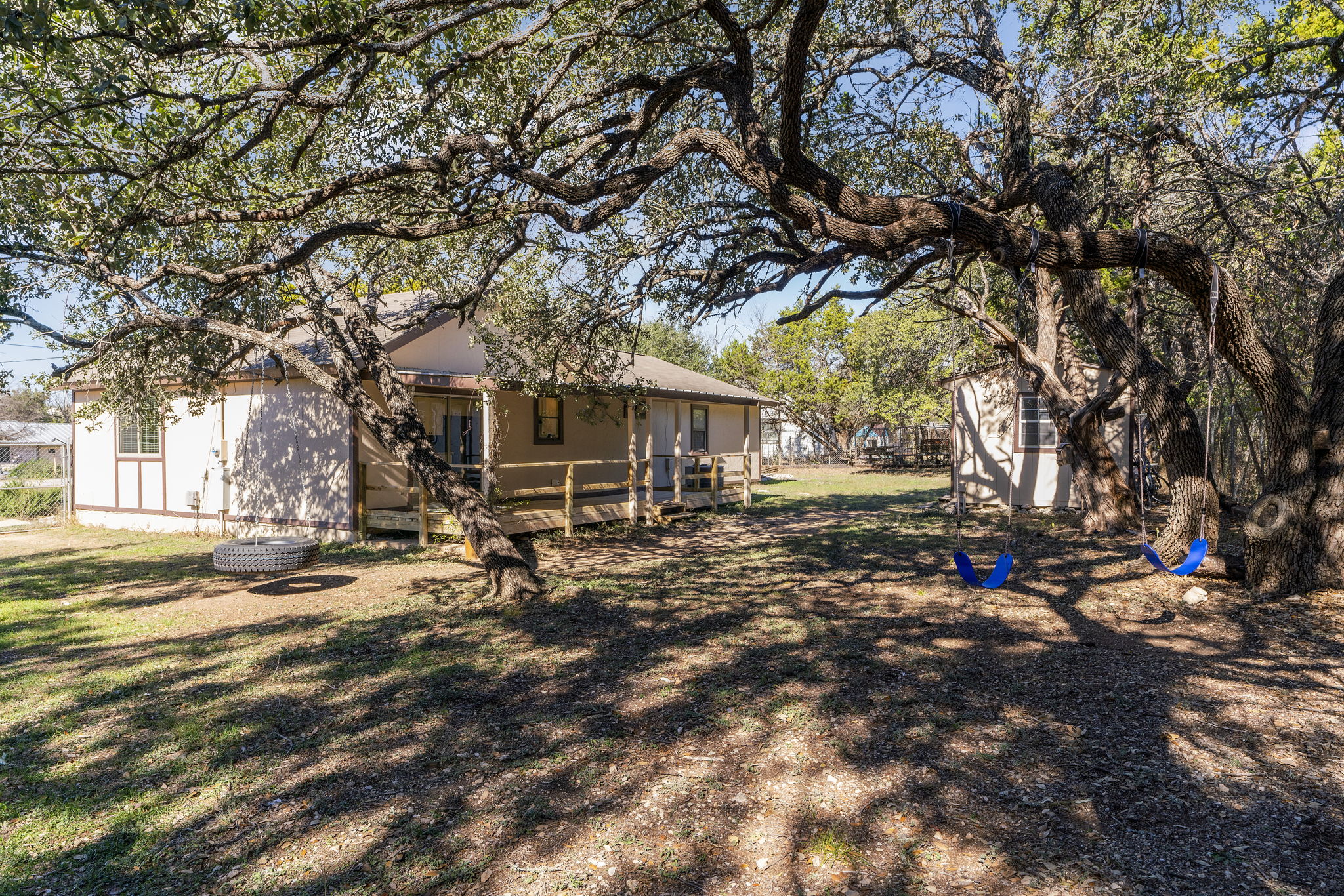 500 Grand Prairie Circle Dripping Springs, TX 78620 - Photo 32 of 40 Rear view of house featuring an outbuilding