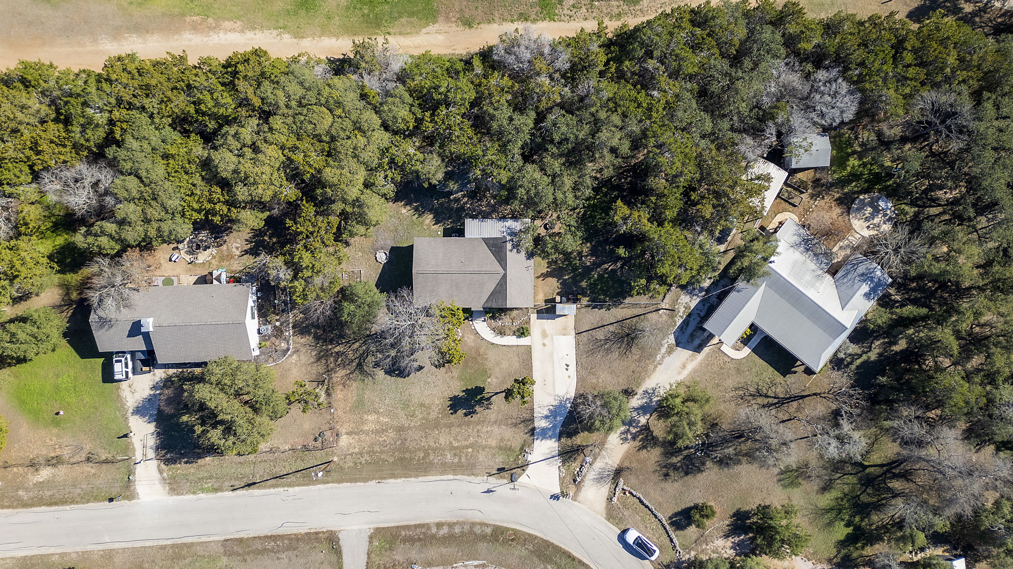 500 Grand Prairie Circle Dripping Springs, TX 78620 - Photo 37 of 40 an aerial view of a house with yard swimming pool and outdoor seating