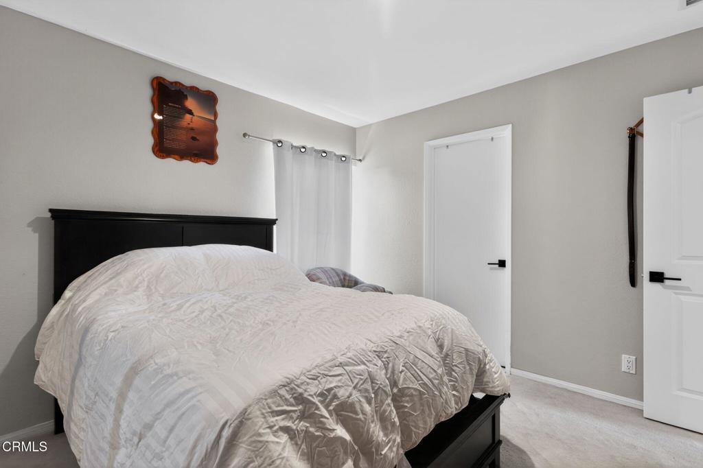 2377 Fitzgerald Road Simi Valley, CA 93065 - Photo 19 of 30 a bedroom with a bed and a wall painting
