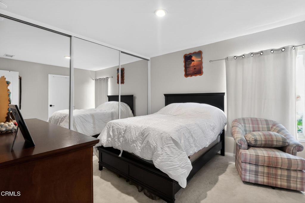 2377 Fitzgerald Road Simi Valley, CA 93065 - Photo 21 of 30 a bedroom with a bed and couch