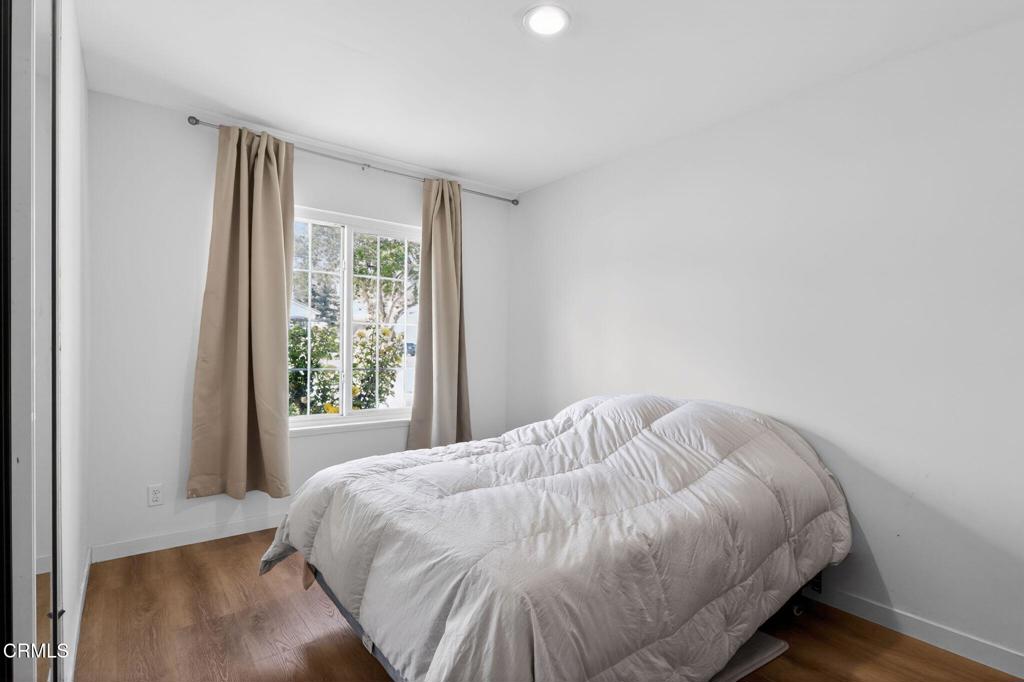 2377 Fitzgerald Road Simi Valley, CA 93065 - Photo 22 of 30 a bed sitting in a bedroom next to a window
