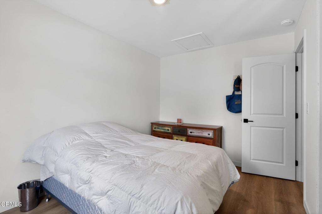 2377 Fitzgerald Road Simi Valley, CA 93065 - Photo 23 of 30 a bedroom with a bed and wooden floor