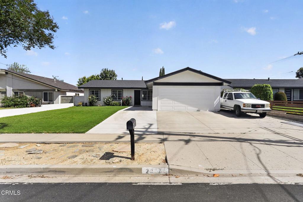 2377 Fitzgerald Road Simi Valley, CA 93065 - Photo 3 of 30 a front view of a house with a yard