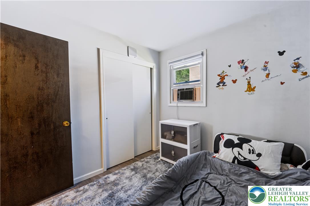 1764 Ritter Street Bethlehem, PA 18015 - Photo 21 of 29 Hardwood floors and sliding closet doors define this cozy second bedroom.