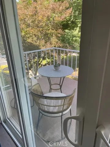 a view of a balcony with chair