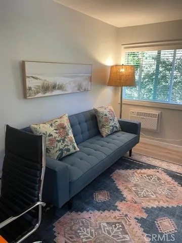 a bedroom with bed and window