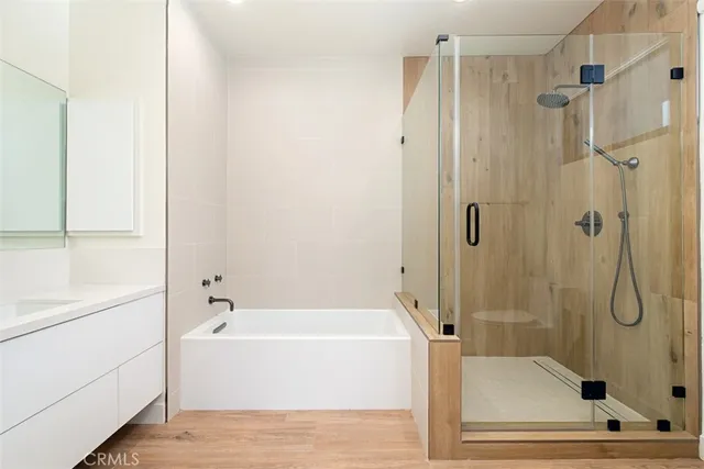 a bathroom with a bathtub and shower
