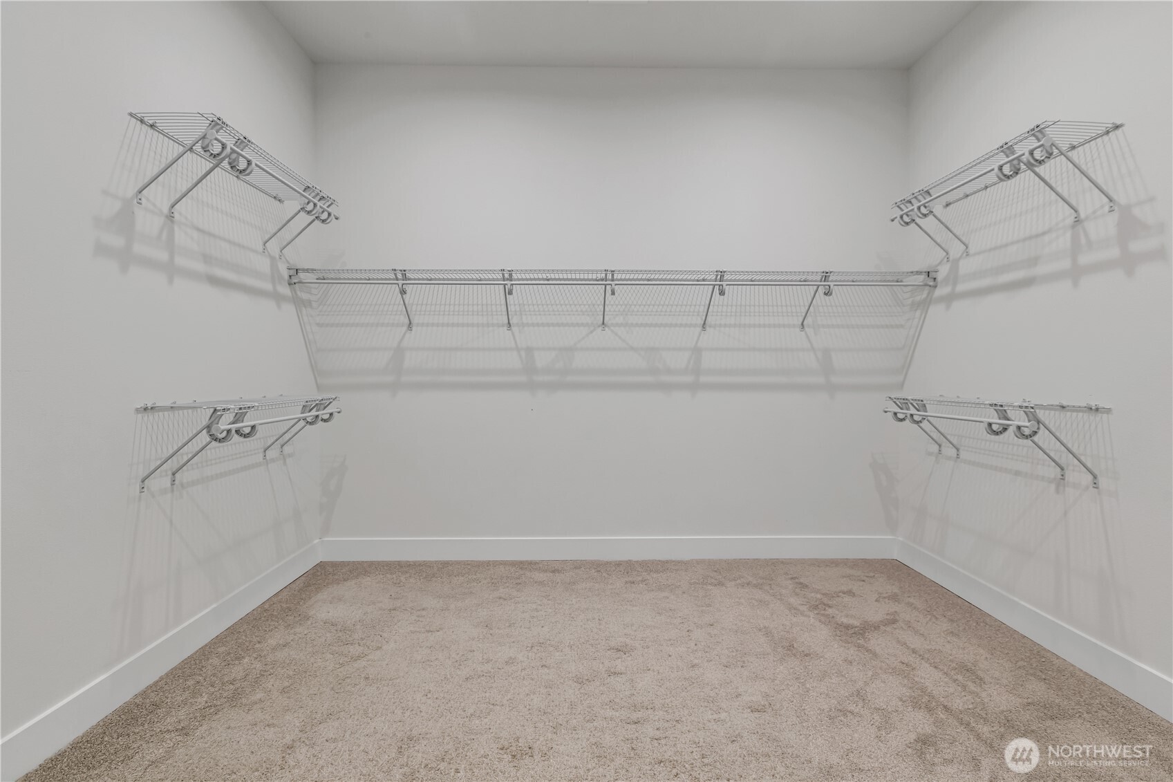6709 254th Street East Graham, WA 98338 - Photo 24 of 40 a view of a room with racks on the wall