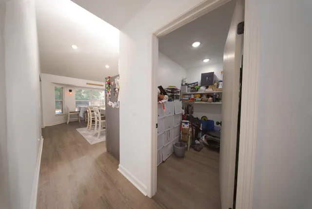 a view of a kitchen and a dining table & chairs