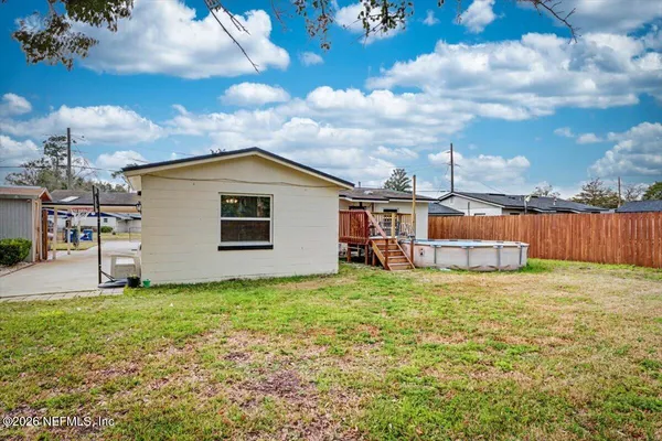 a bathroom with a sink and a yard