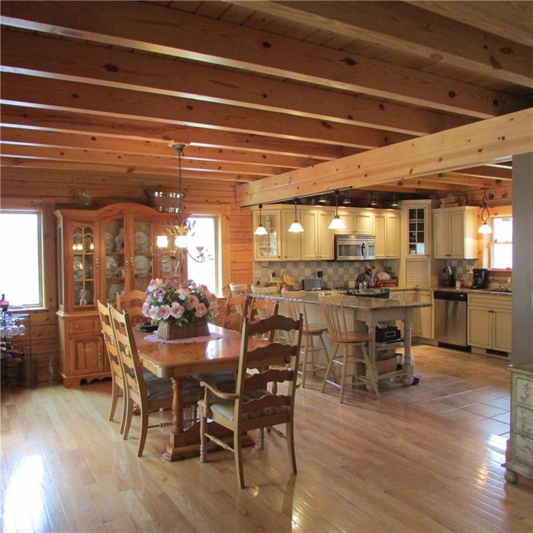 189 Upper Service Road Hookstown, PA 15050 - Photo 7 of 25 Open floor plan kitchen,dining room and living room. Hardwood flooring in dining room and living room. Open ceiling beams throughout the home.