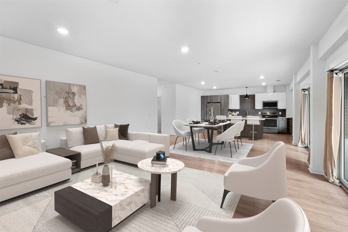 4361 South Congress Avenue, Unit 333 Austin, TX 78745 - Photo 11 of 40 a living room with furniture and a view of kitchen