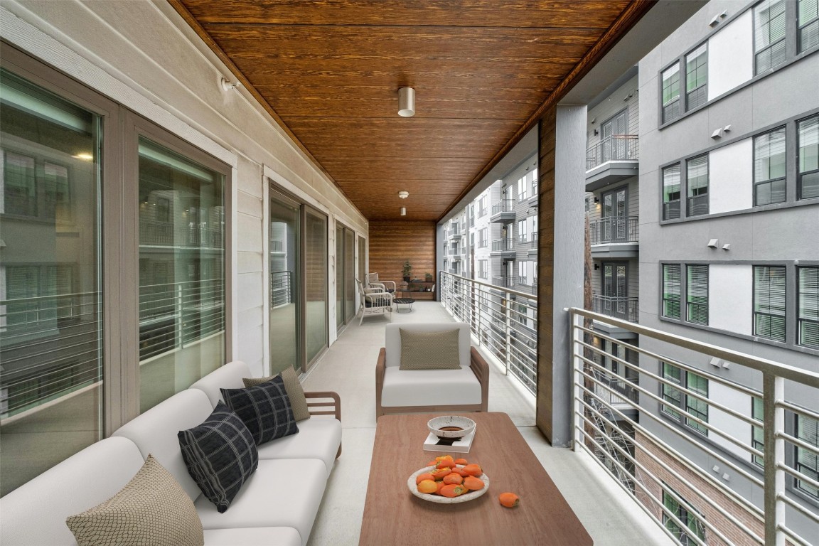 4361 South Congress Avenue, Unit 333 Austin, TX 78745 - Photo 3 of 40 a balcony with furniture and a potted plant