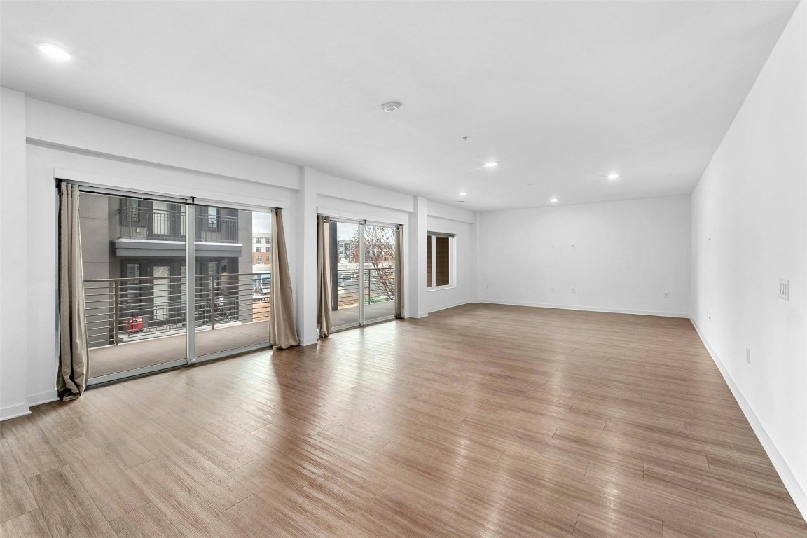 4361 South Congress Avenue, Unit 333 Austin, TX 78745 - Photo 10 of 40 a view of an empty room with glass door and windows