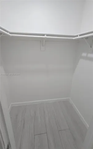 a bathroom with a granite countertop toilet a sink and bathtub