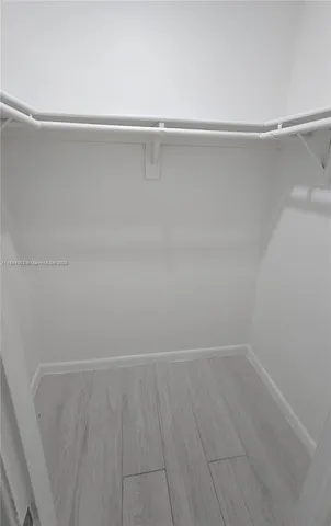 a bathroom with a granite countertop toilet a sink and bathtub