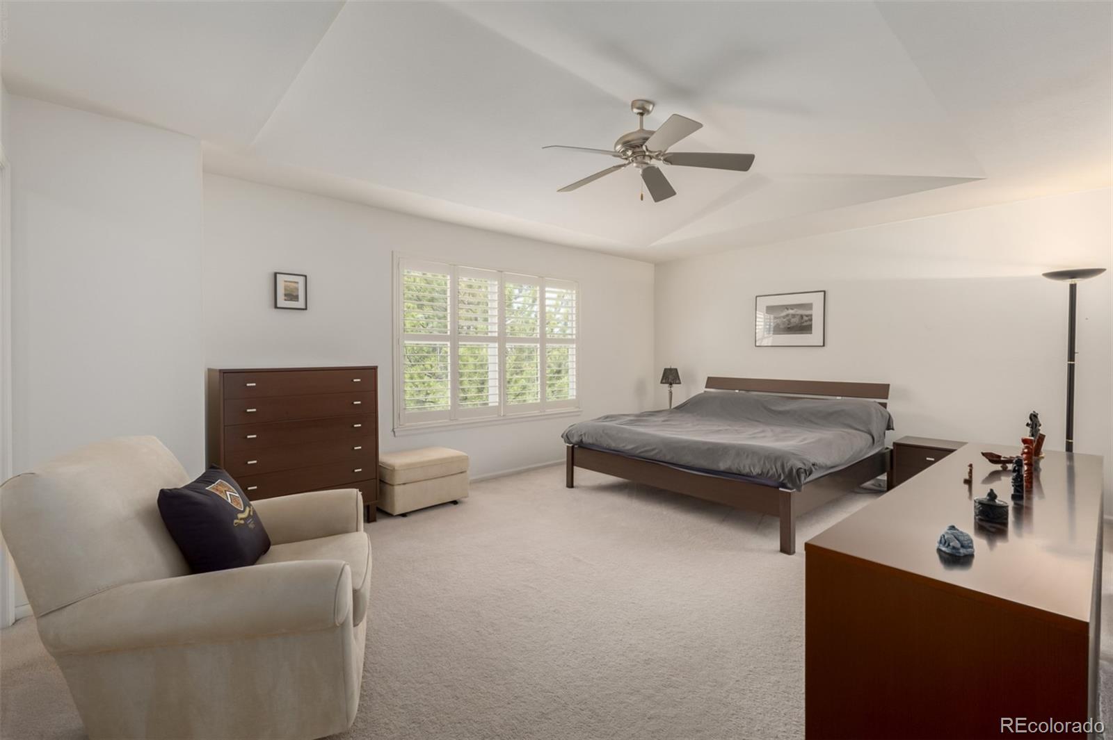 707 Huntington Place Highlands Ranch, CO 80126 - Photo 16 of 50 a bedroom with furniture and a window
