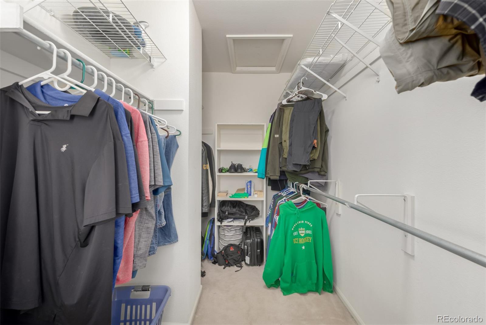 707 Huntington Place Highlands Ranch, CO 80126 - Photo 19 of 50 a view of walk in closet with clothes and shoes