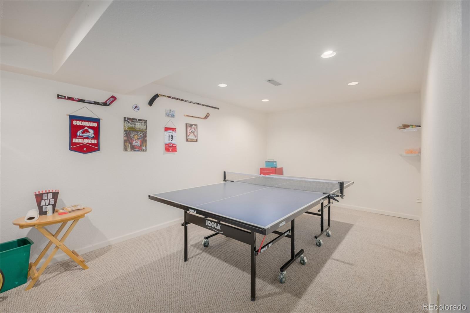 707 Huntington Place Highlands Ranch, CO 80126 - Photo 33 of 50 a room with gym equipment and wooden floor