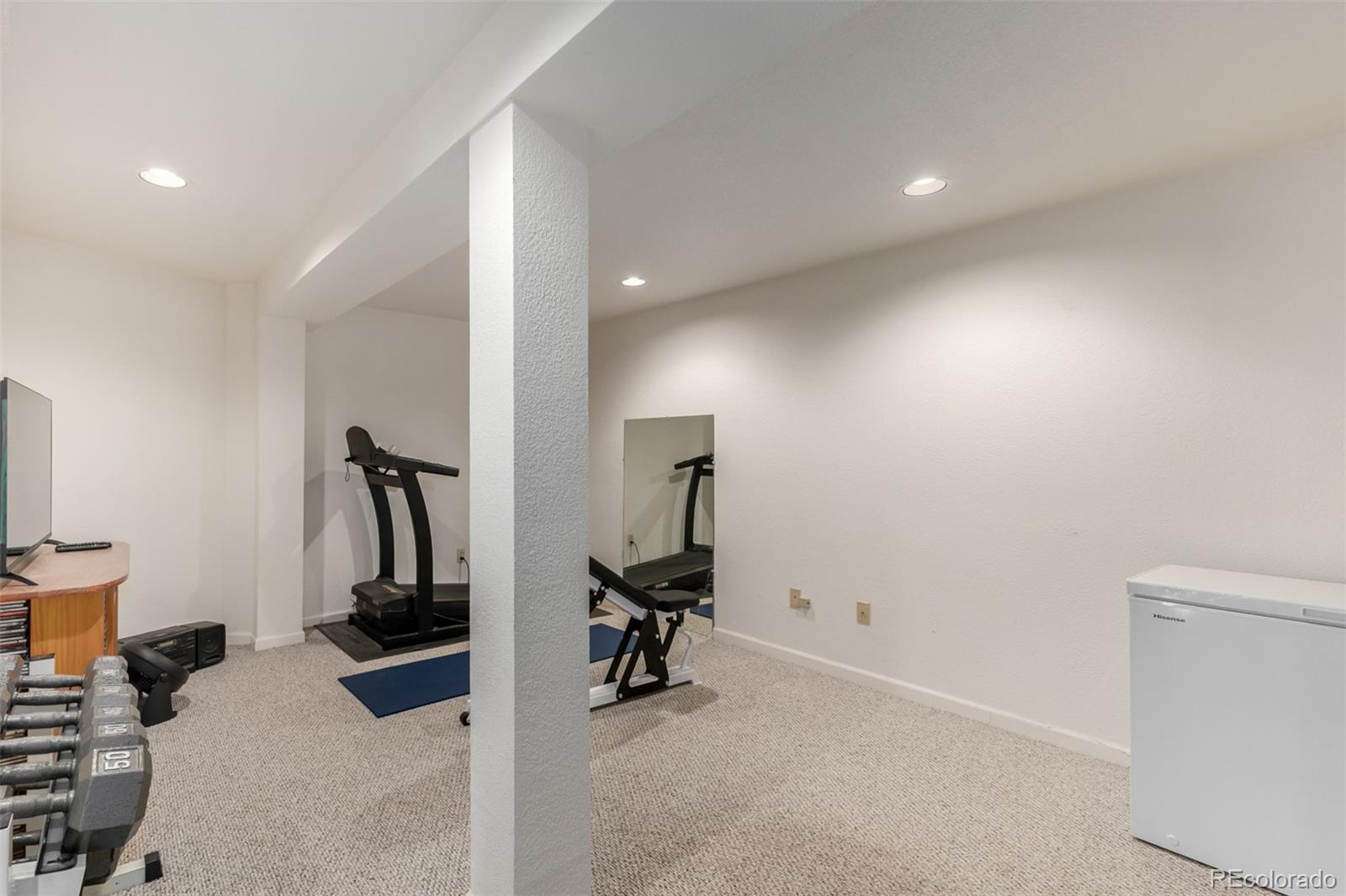 707 Huntington Place Highlands Ranch, CO 80126 - Photo 35 of 50 a view of a room with gym equipment