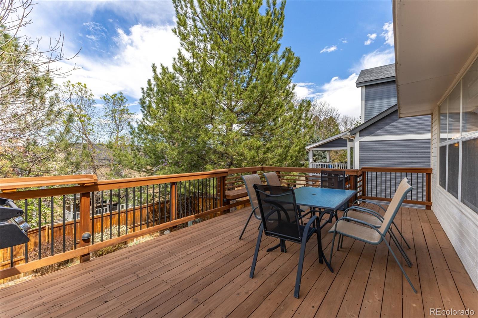 707 Huntington Place Highlands Ranch, CO 80126 - Photo 41 of 50 a view of a deck patio and outdoor seating