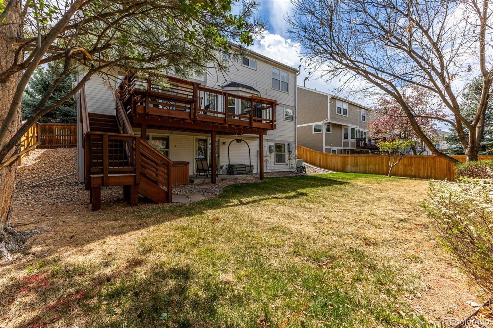 707 Huntington Place Highlands Ranch, CO 80126 - Photo 45 of 50 a view of a house with a yard