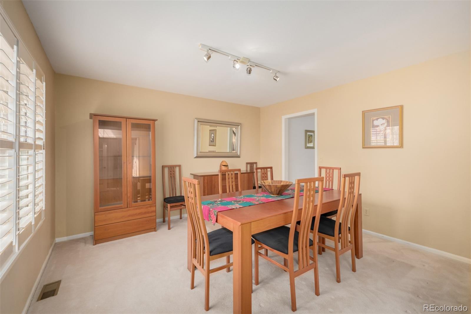 707 Huntington Place Highlands Ranch, CO 80126 - Photo 10 of 50 a view of a dining room with furniture and window