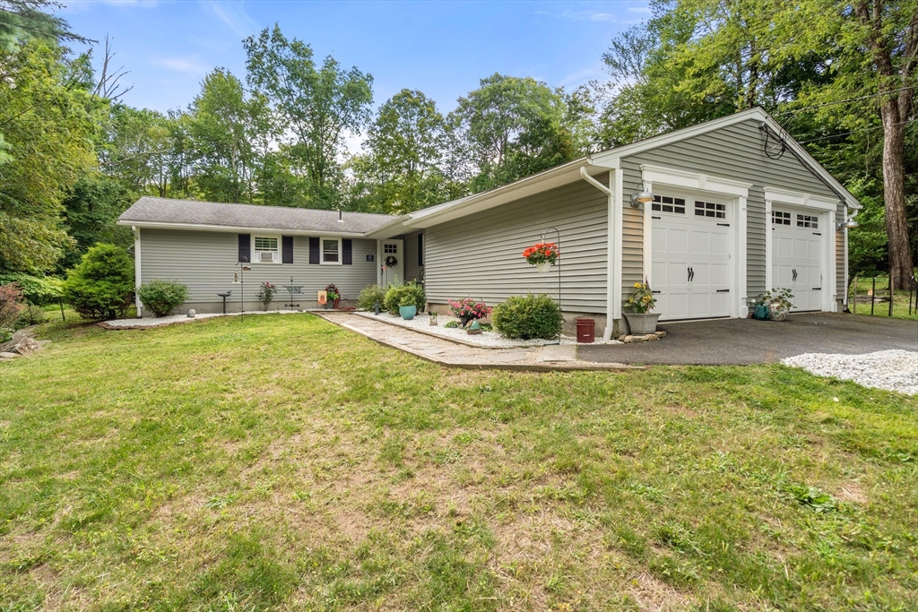 1 Sunset Rock Road Wilbraham, MA 01095 - Photo 1 of 24 a view of a house with a yard and potted plants