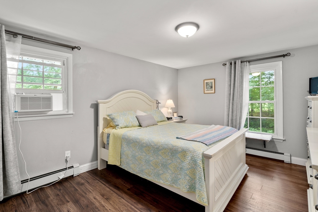 1 Sunset Rock Road Wilbraham, MA 01095 - Photo 15 of 24 a bedroom with a bed and wooden floor