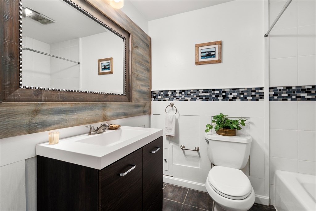 1 Sunset Rock Road Wilbraham, MA 01095 - Photo 20 of 24 a bathroom with a toilet a sink and a mirror