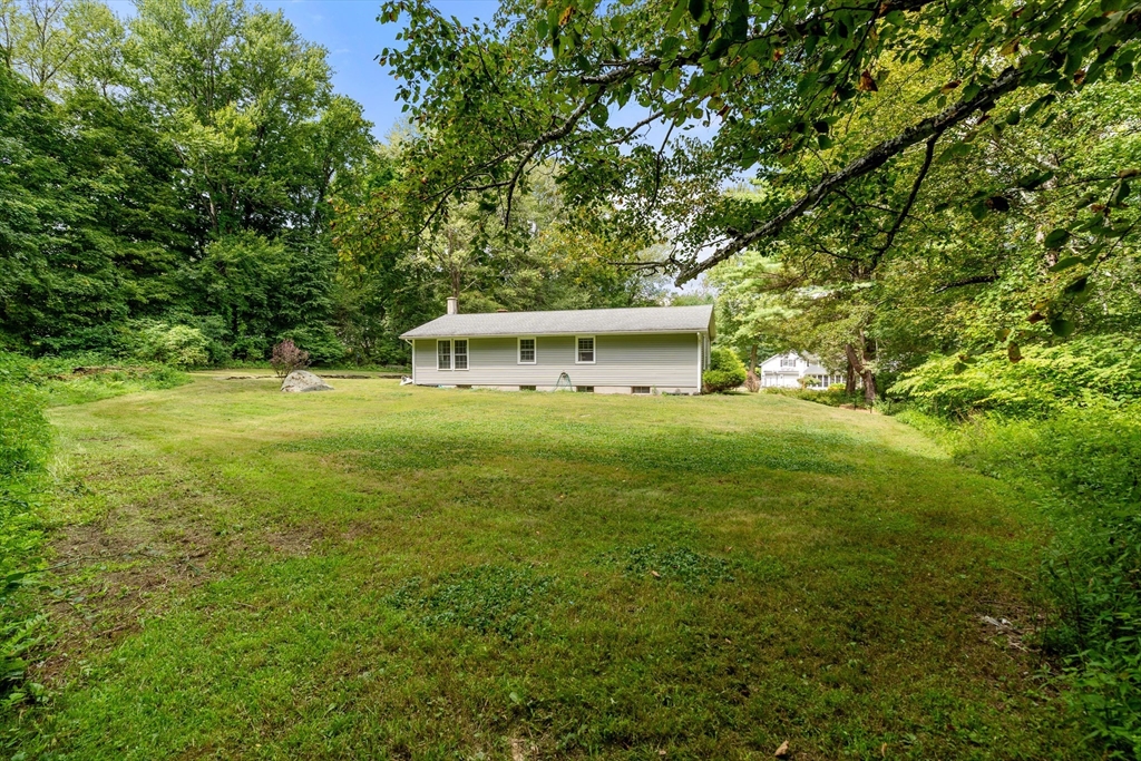 1 Sunset Rock Road Wilbraham, MA 01095 - Photo 22 of 24 a view of a big yard with large trees