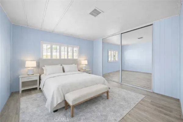a bedroom with a bed and a walk in closet