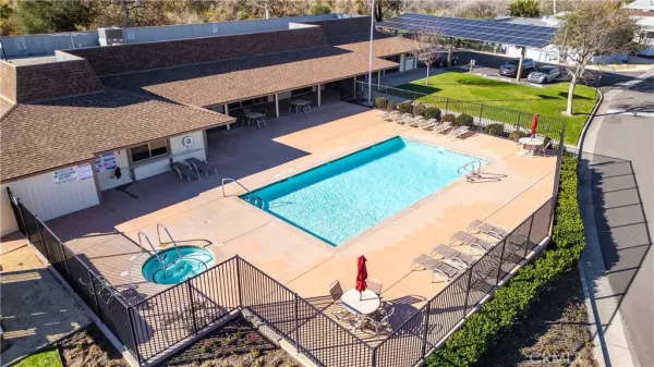 an aerial view of residential houses and outdoor space