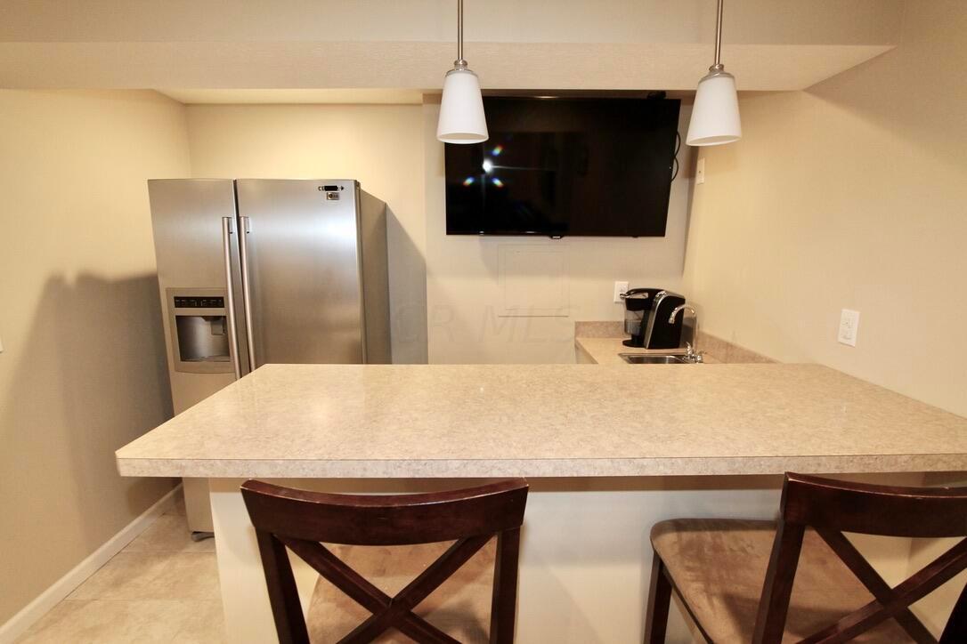4836 Heath Trails Road Hilliard, OH 43026 - Photo 23 of 32 Wet Bar with sink & Fridge
