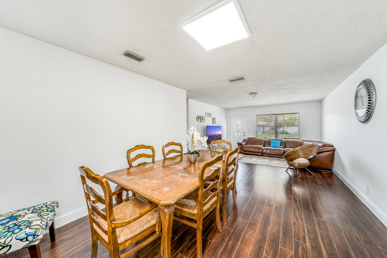 19322 Delaware Court Boca Raton, FL 33434 - Photo 13 of 43 a dining room with furniture and wooden floor