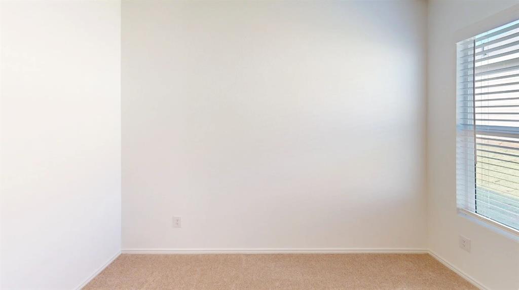 9757 Platteview Road Fort Worth, TX 76179 - Photo 10 of 19 Neutral toned carpet flooring and light-colored walls