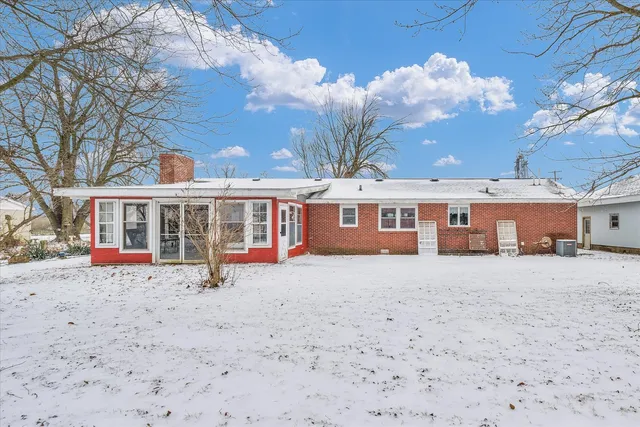 a view of a house with a yard and garage