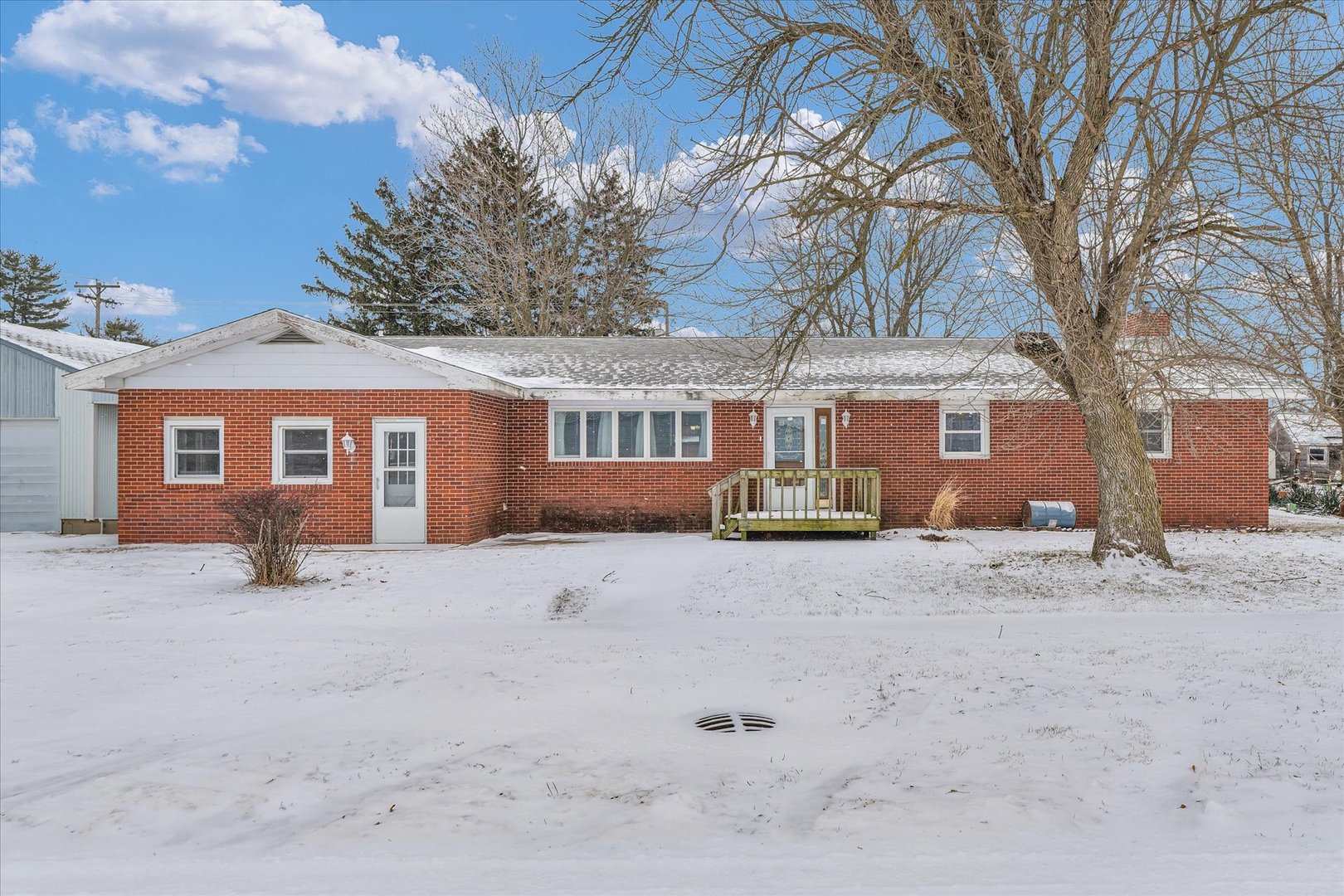 103 South Walnut Street Arrowsmith, IL 61722 - Photo 4 of 39 a view of a house with a yard covered in snow