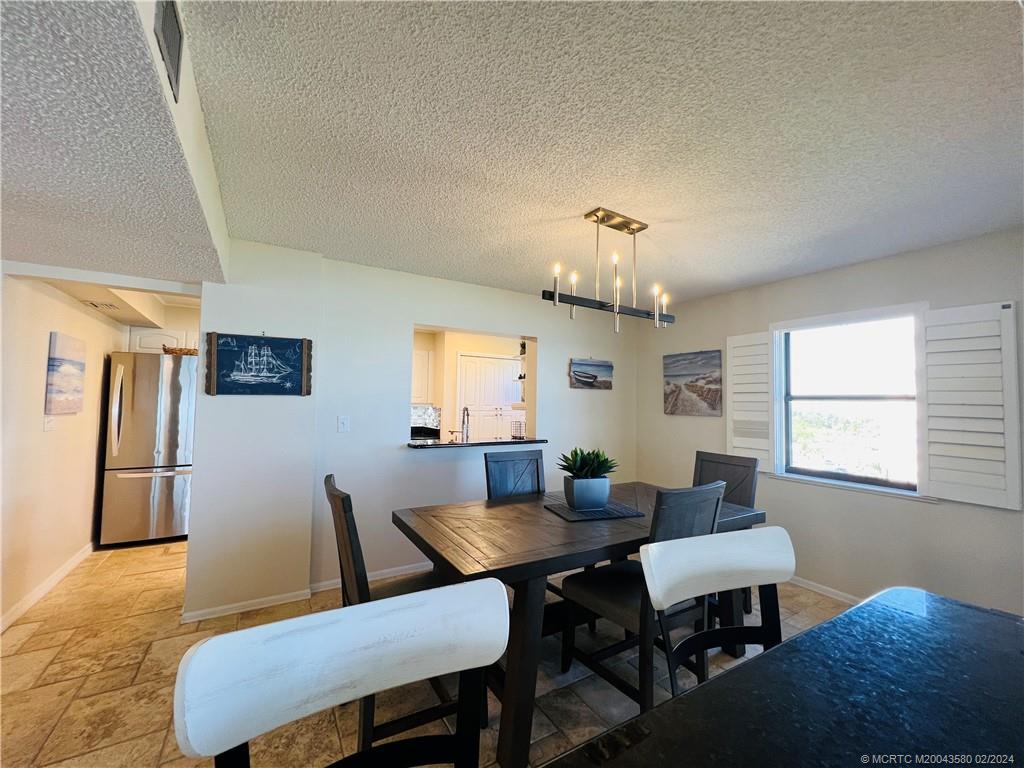 Undisclosed Address Jensen Beach, FL 34957 - Photo 17 of 86 a view of a dining room with furniture