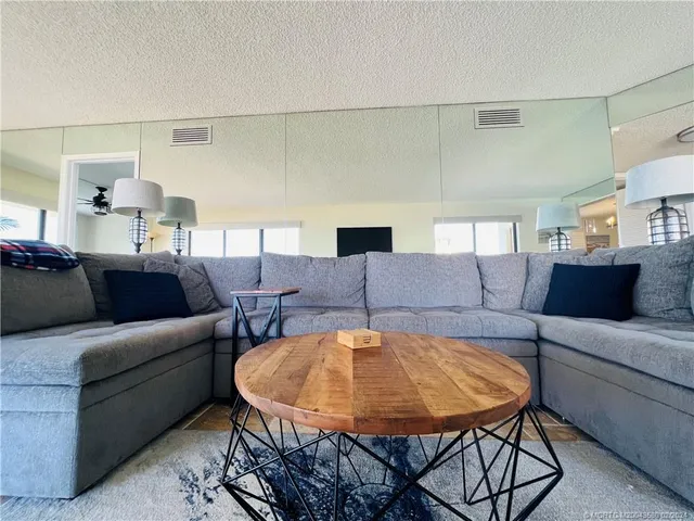 a view of a balcony with a table and chairs