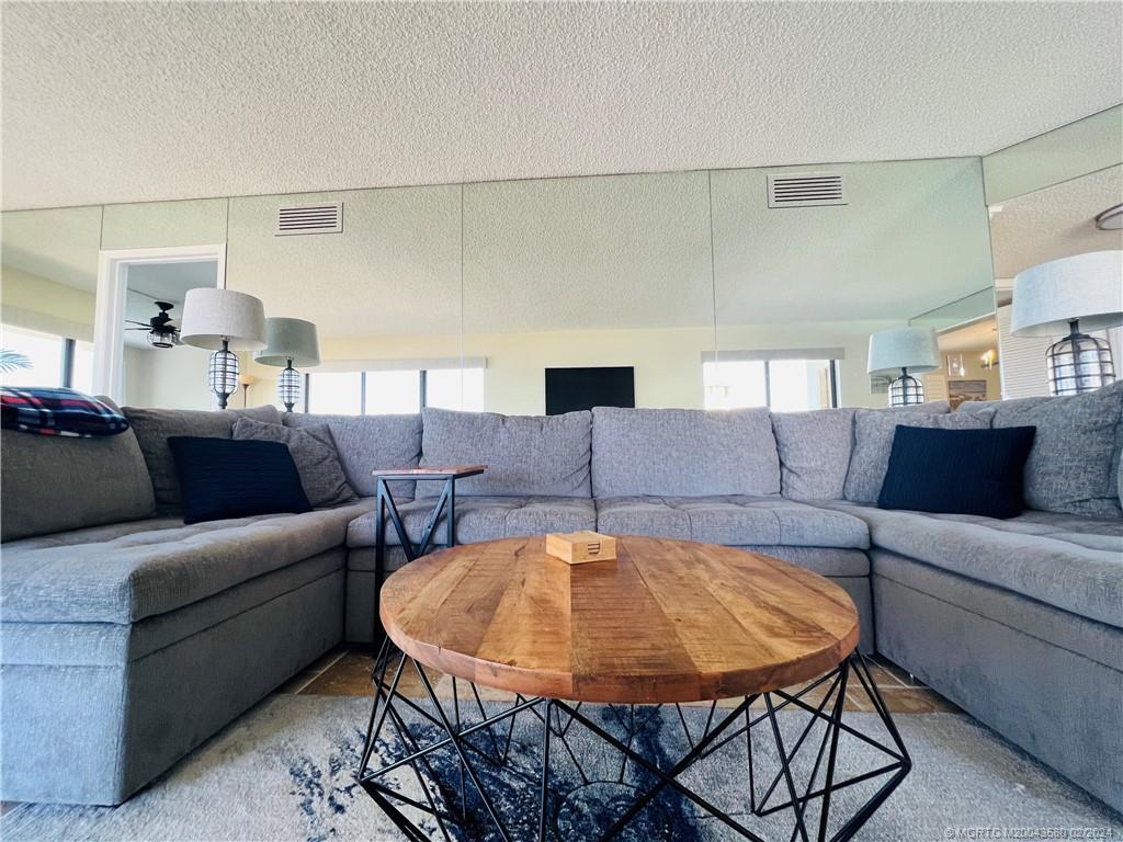 Undisclosed Address Jensen Beach, FL 34957 - Photo 27 of 86 a living room with furniture and a dining table